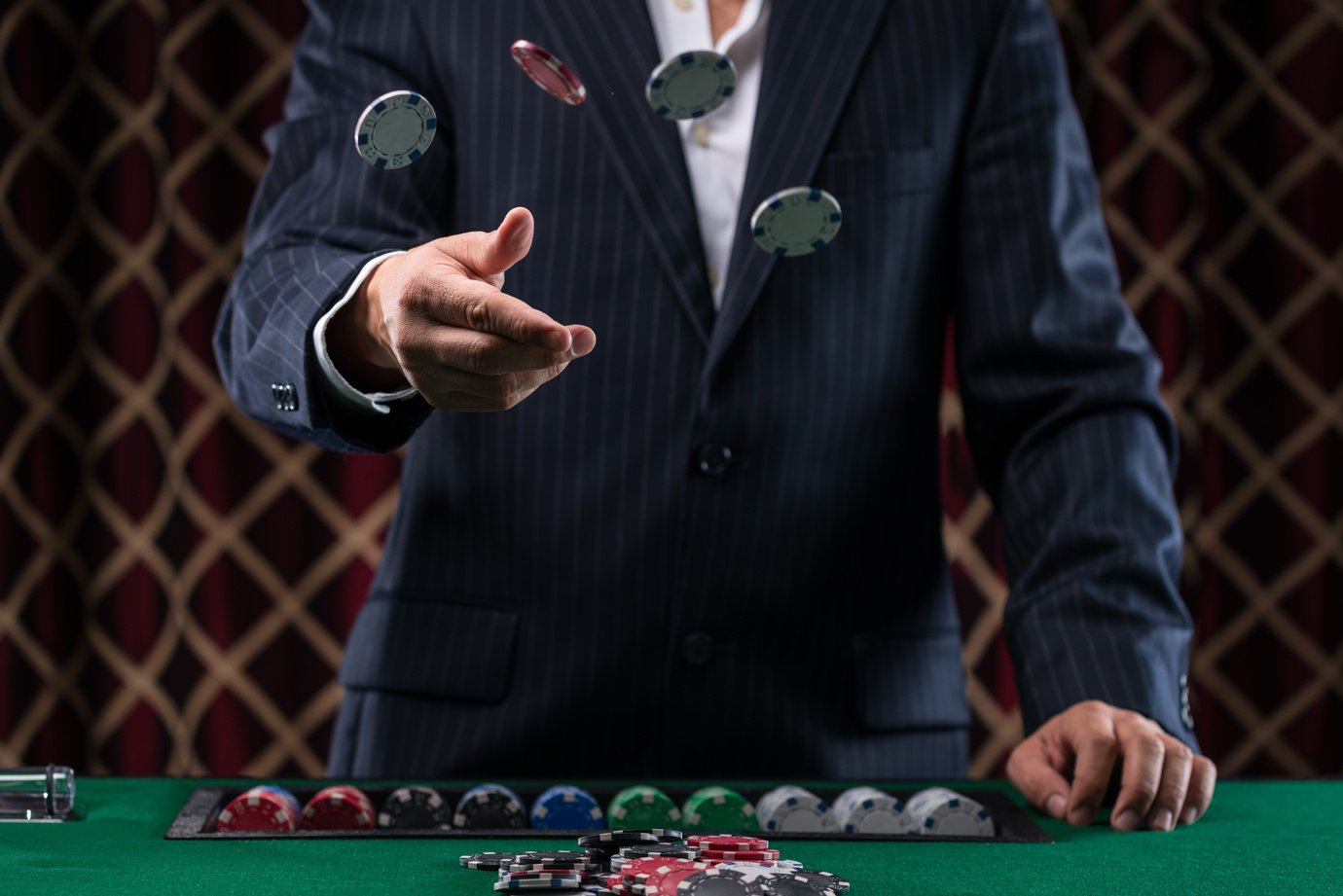 Close-Up of Man Throwing a Poker Chips